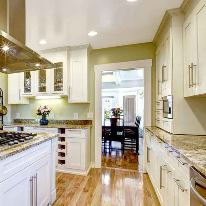 Bright finished kitchen with white cabinetry